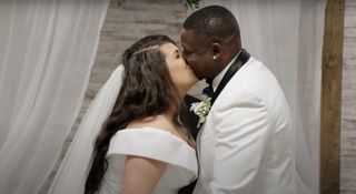Emily and Kobe kissing on their wedding day 90 Day Fiancé season 9