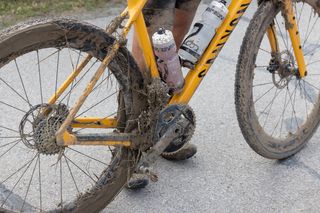 Bikes were clogged with 'peanut butter mud' after the early mud pit