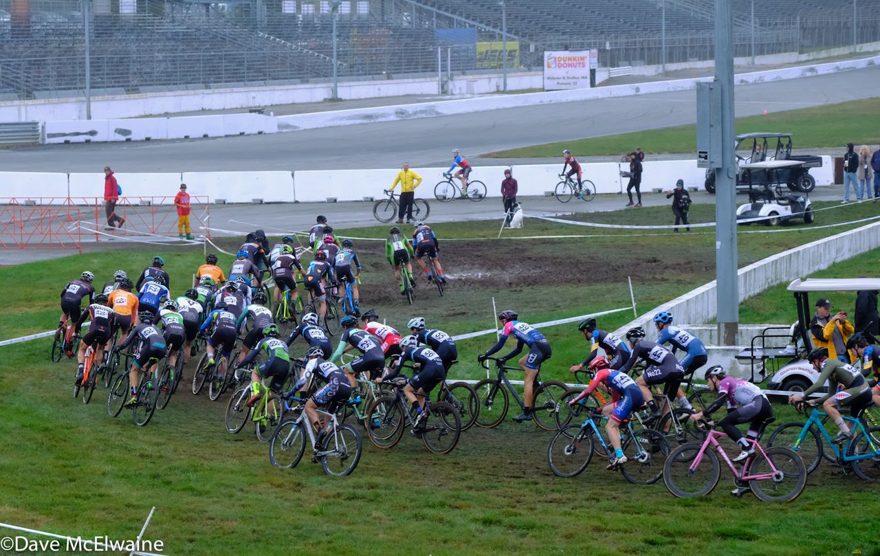 The Mens field approaches the crossing of the Speedway