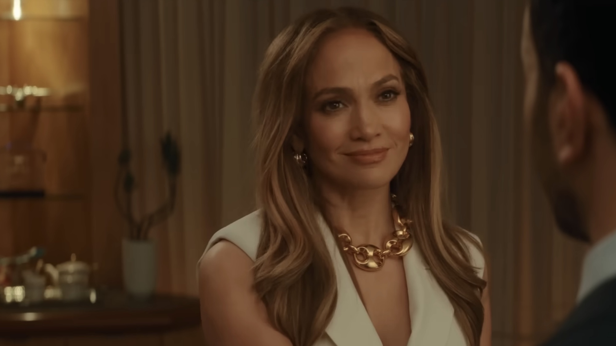 JLo smiling in the Office Romance trailer