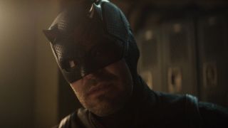 Daredevil in his mask talking to Bullseye about forgiveness. 