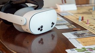 A Meta Quest 3s on the table with the board game Botany