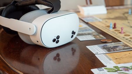 A Meta Quest 3s on the table with the board game Botany