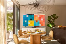 room with modern design aesthetic, and samsung the frame tv displaying artwork