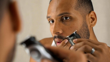 man shaving his face