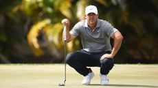 Brooks Koepka lines up a putt at the Cognizant Classic at PGA National