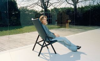 Image of Francesca Molteni, sitting on an armchair outside