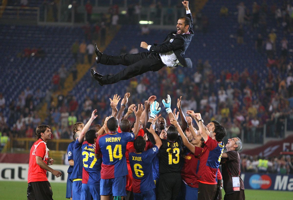 Barcelona manager Pep Guardiola is thrown in the air by his players in celebration after victory against Manchester United in the 2009 Champions League final at the Stadio Olimpico in Rome, Italy