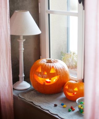 Carved pumpkins in window