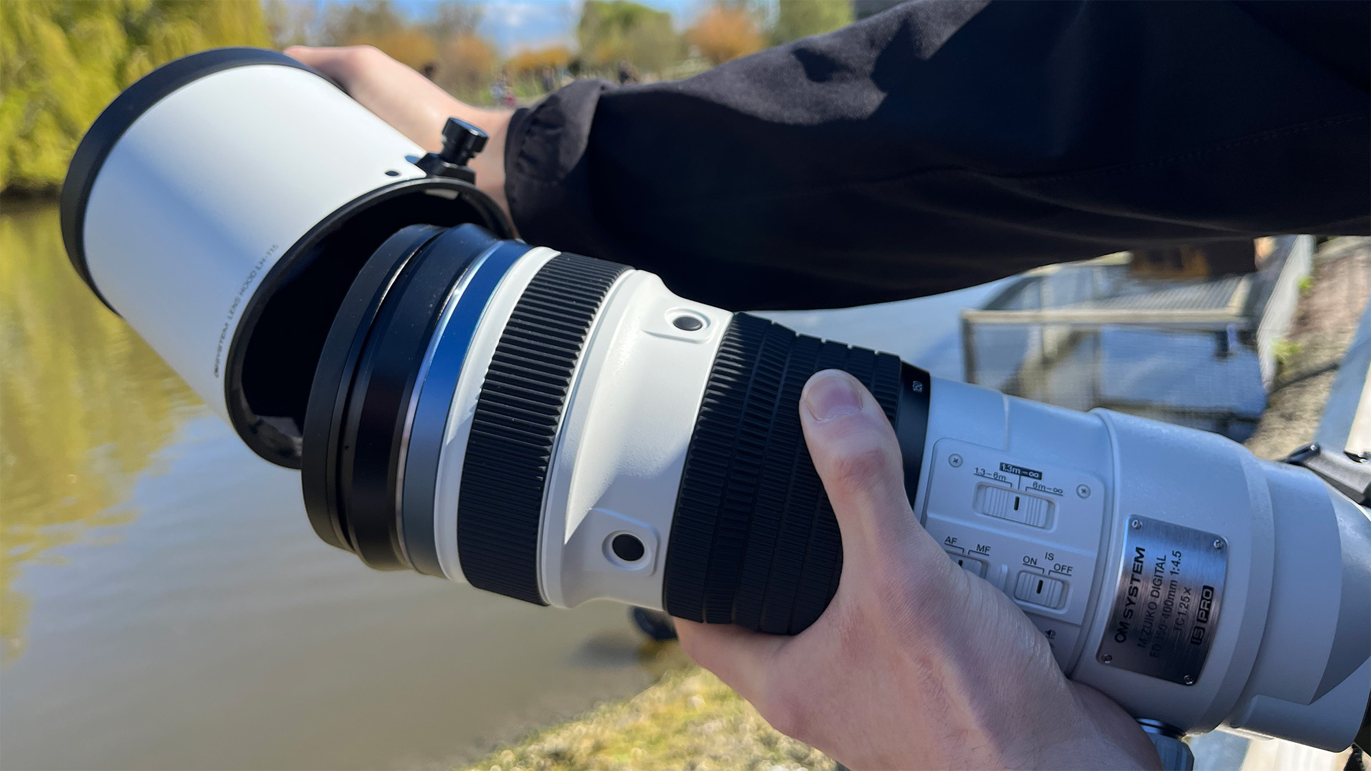Mike Harris holding OM System M.Zuiko 150-400mm f/4.5 TC1.25x IS PRO at Slimbridge Wetland Centre