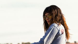 Adria Arjona wearing sunglasses in Onslaught.