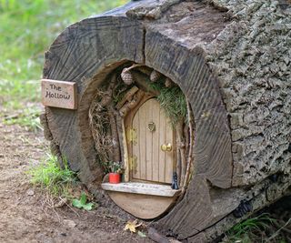 fairy garden house created in an old log