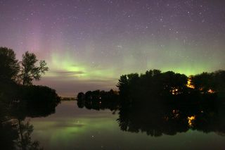 Skywatchers in Wisconsin took this image of green auroras reflecting off the water.