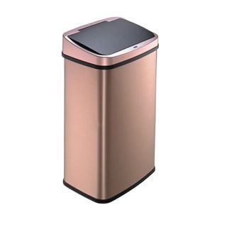 A rose gold kitchen trash can