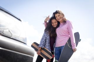 mum and daughter skateboarding