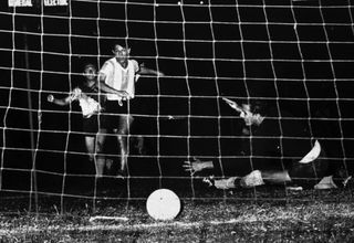 Omar Sivori scores a goal for Argentina in the 1950s.