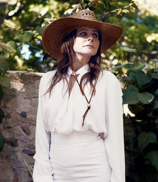 Clothing, Hat, Sleeve, People in nature, Headgear, Sun hat, Costume accessory, Street fashion, Long hair, Fashion model,