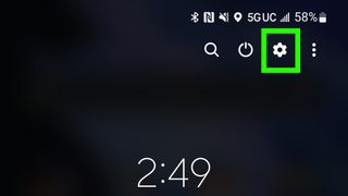 The Settings icon highlighted with a green box in the pulldown menu