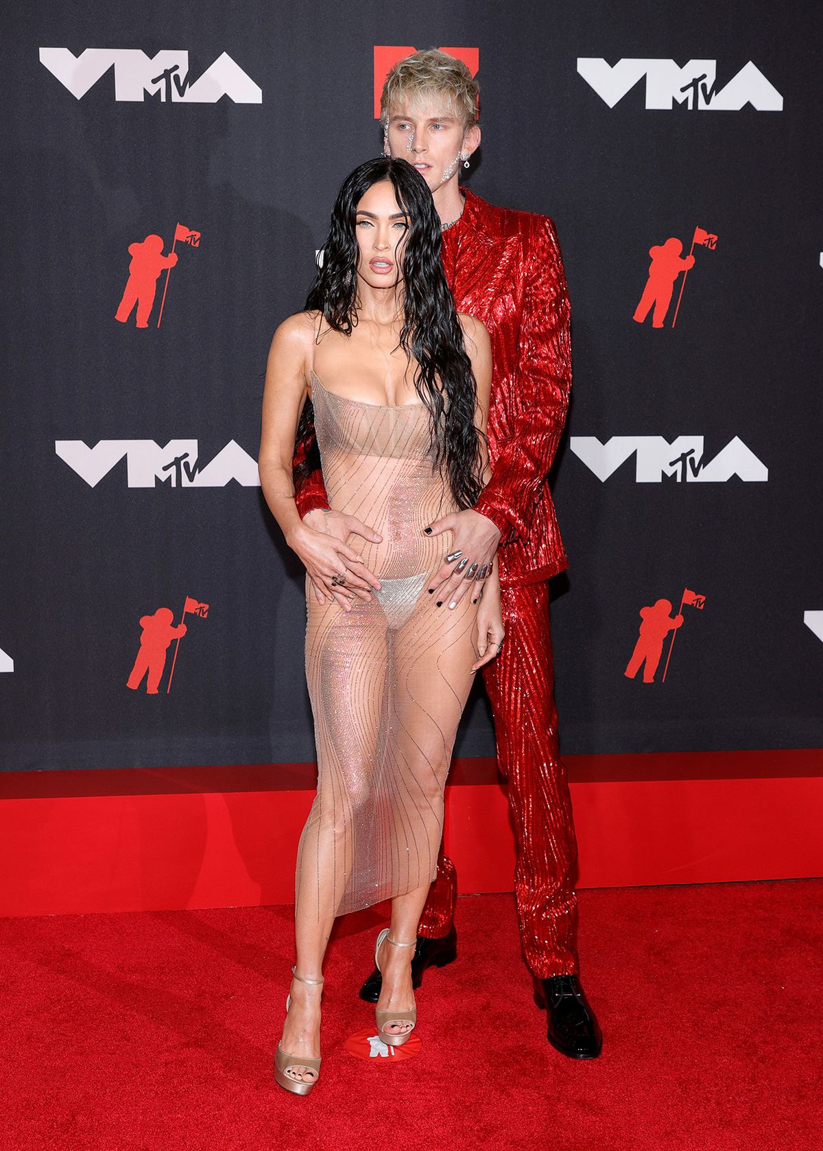 Megan Fox and MGK on red carpet at MTV VMAs 2021. 