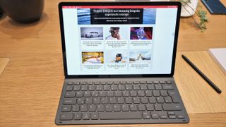 Samsung Galaxy Tab S8 Ultra review: tablet with snap-on keyboard on a wooden table