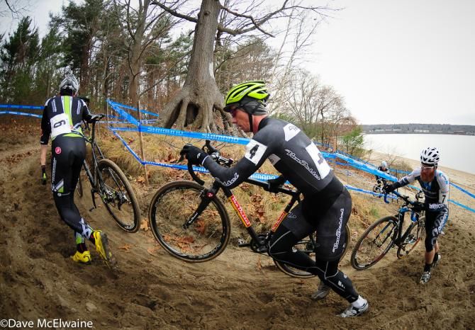 Mike Garrigan (Van Dessel) pushing his bike on a run-up