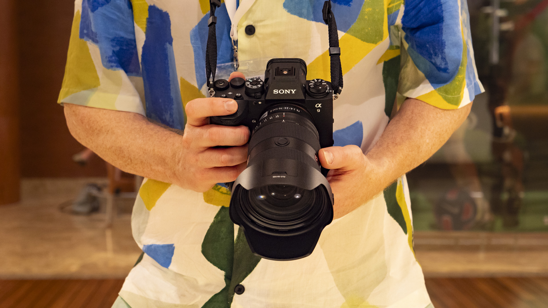 Sony A9 III in the hand with lens attached