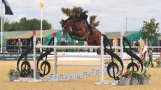 Madison Heath and BP Millionaire clear an oxer at the British Showjumping National Championships