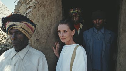 British actress and humanitarian Audrey Hepburn (1929 - 1993) with locals on her first field mission for UNICEF in Ethiopia, 16th-17th March 1988. (Photo by Derek Hudson/Getty Images)