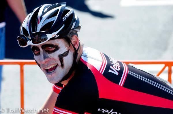 An amateur racer flashing a smile at the officials.