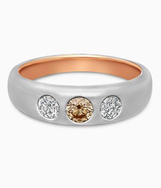 Silver band with three citrus coloured diamonds set into it