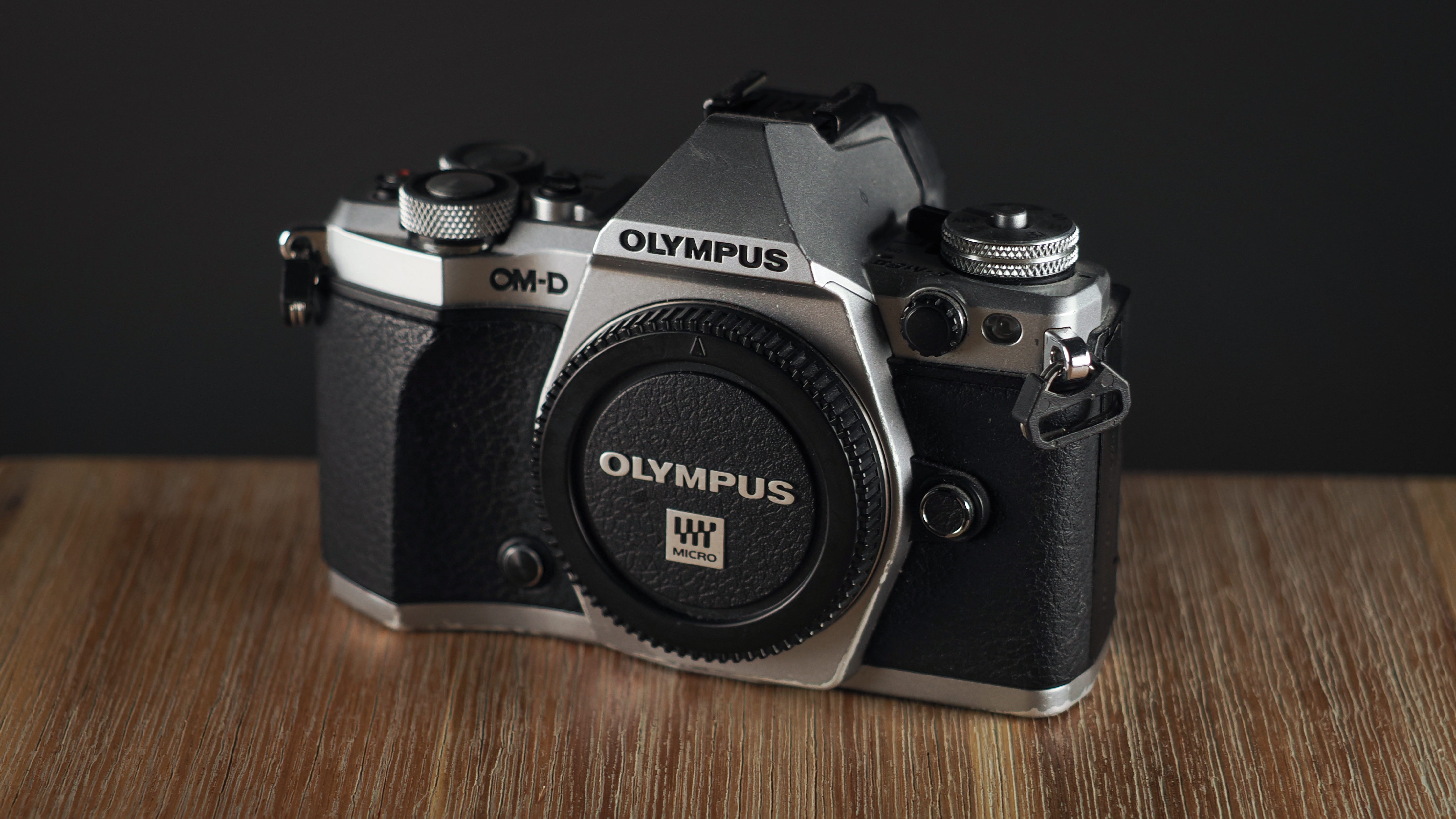 Olympus OM-D E-M5 Mark II on a wooden surface