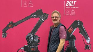 MultiDyne Frank Jachetta with robotic arms. 