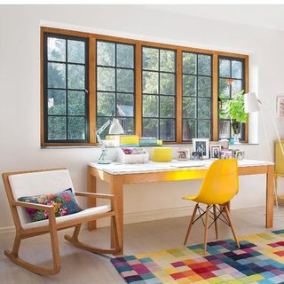 office room with table and yellow chair