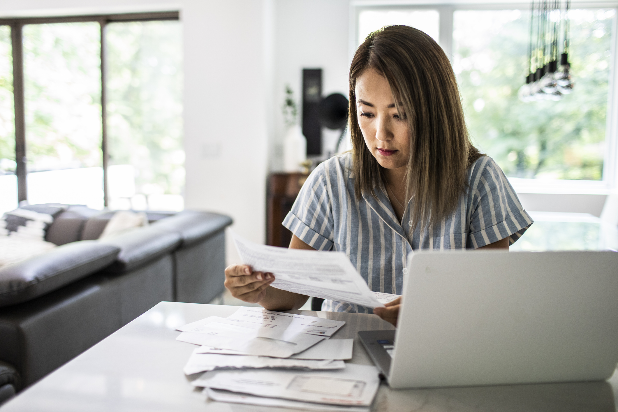 Woman arranging paperwork for a lasting power of attorney
