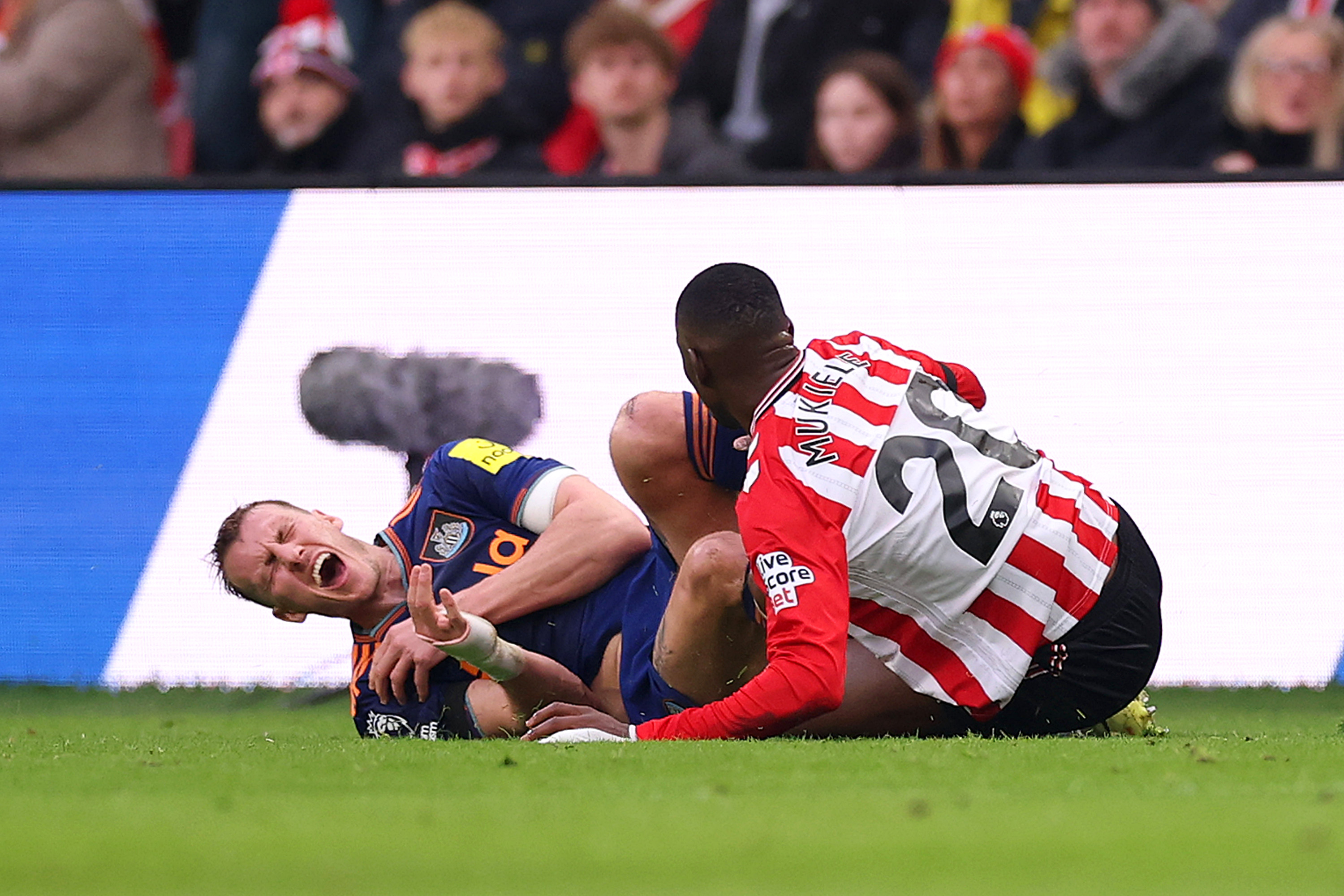 SUNDERLAND, ENGLAND - DECEMBER 14: Dan Burn of Newcastle United reacts after being fouled by Nordi Mukiele of Sunderland during the Premier League match between Sunderland and Newcastle United at Stadium of Light on December 14, 2025 in Sunderland, England. (Photo by Carl Recine/Getty Images)