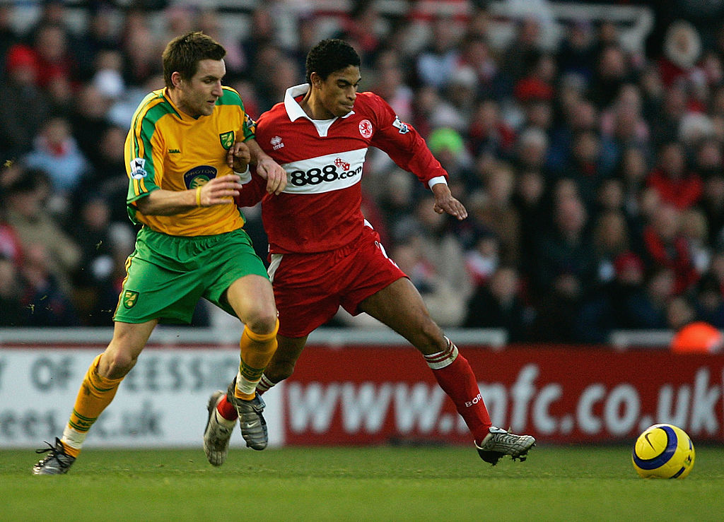 Michael Reiziger of Middlesbrough tackles Jim Brennan of Norwich during the Barclays Premiership match between Middlesbrough and Norwich at The Riverside on December 28, 2004 in Middlesbrough, England.