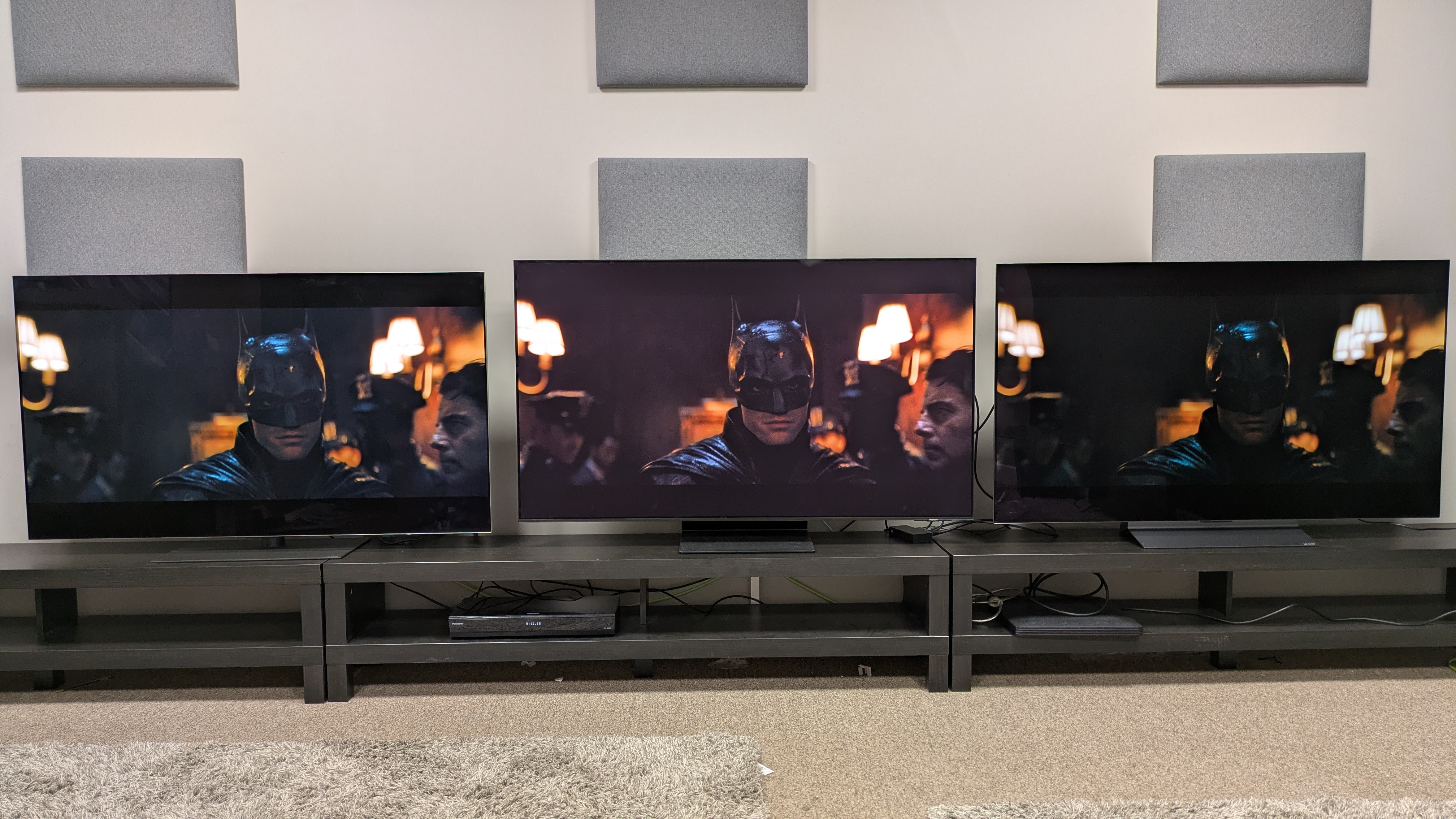 LG G5 (left) vs Samsung S95F (middle) vs LG C5 (right) showing Batman in a dimly lit hallway from The Batman on screen