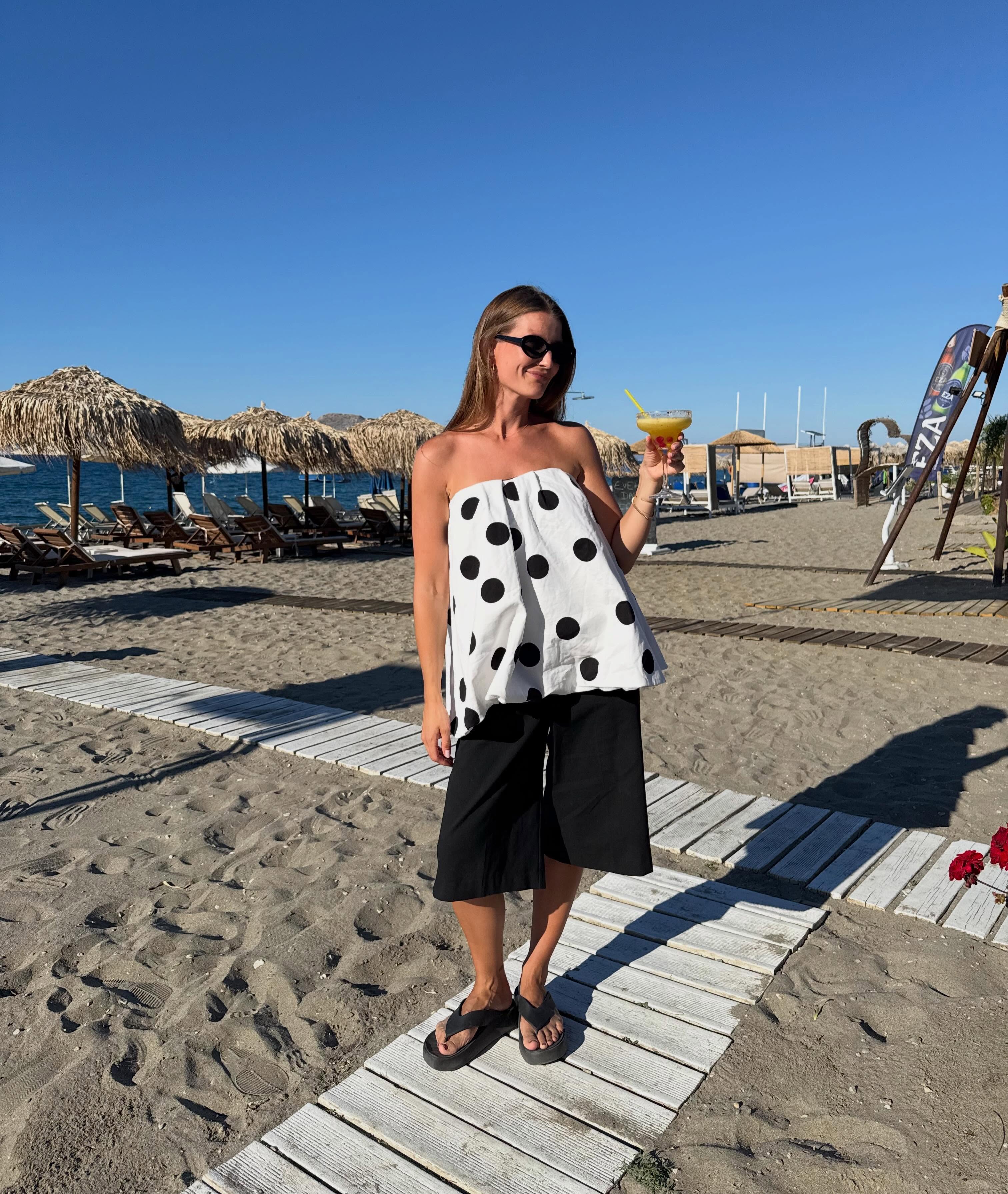 A woman wearing the thick-thong-sandal trend.