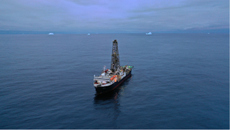 A ship carries a massive tower.