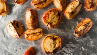 Baked apples on a baking tray covered with tin foil