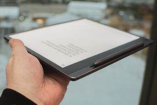Lenovo Smart Paper e ink writable tablet with book on screen