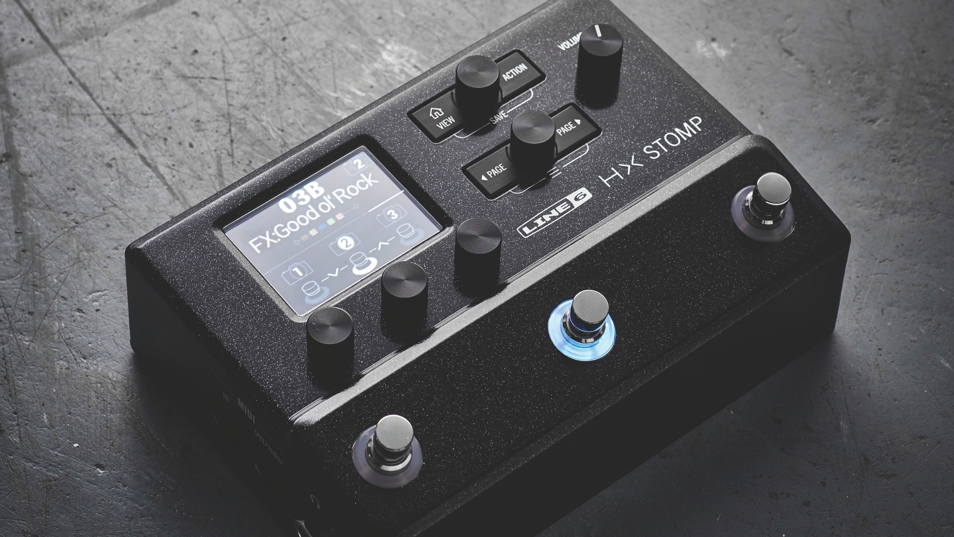A Line 6 HX Stomp multi-effects pedal on a concrete floor