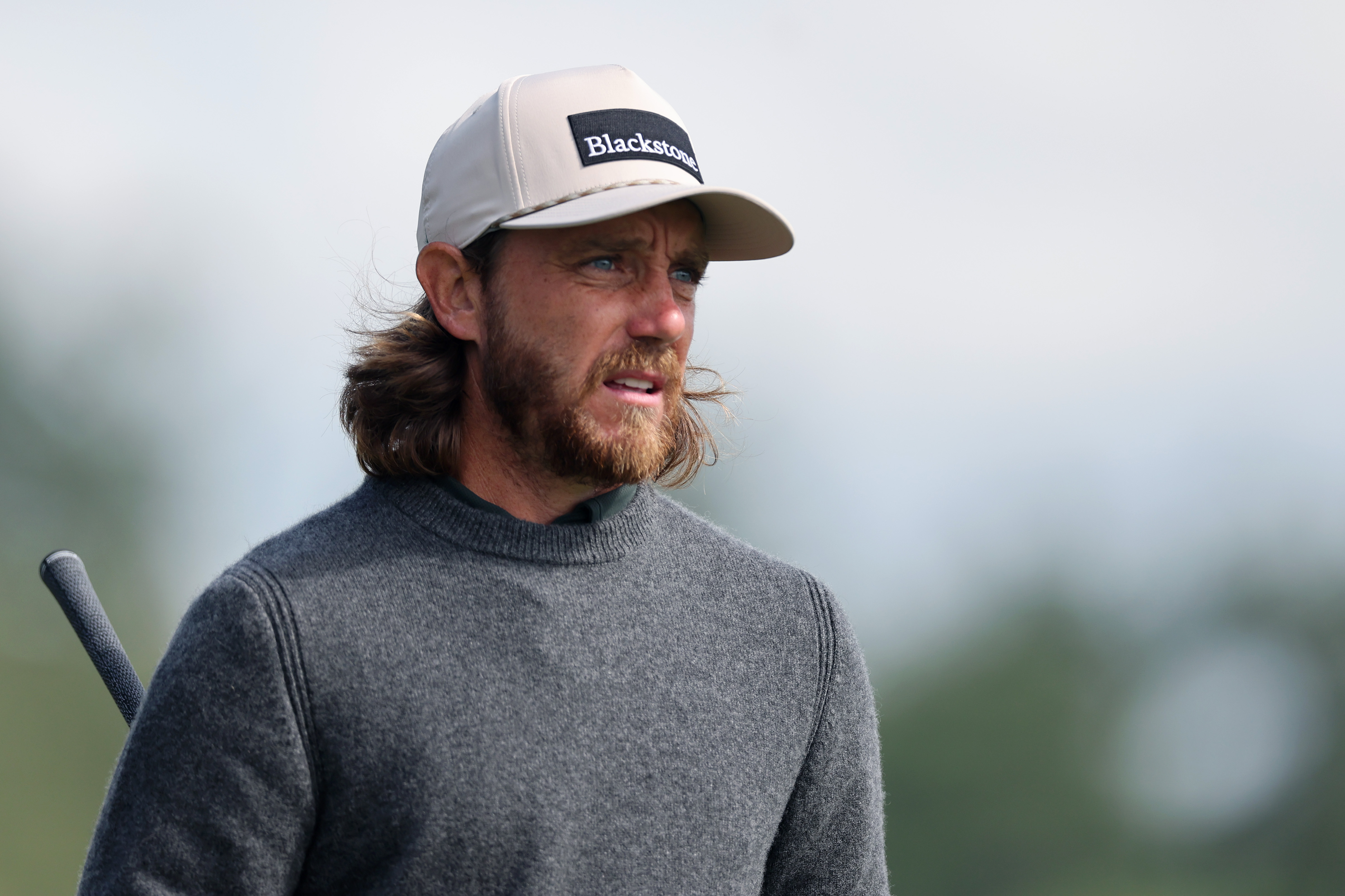 Tommy Fleetwood wearing a grey cashmere sweater and a beige Blackstone cap during the 2026 PGA Championship