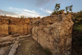 Sunset over the excavated ruins of the ancient city of the bronze age called Ugarit, Syria.