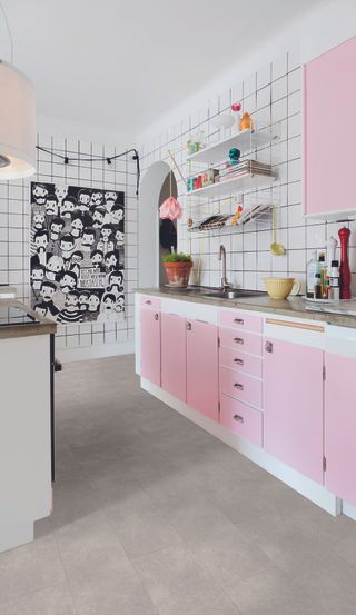 small galley kitchen with white and pink scheme and monochrome feature wall by tile mountain