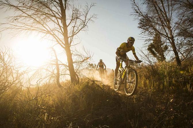 Urs Huber of Bulls leads the group through some singletrack