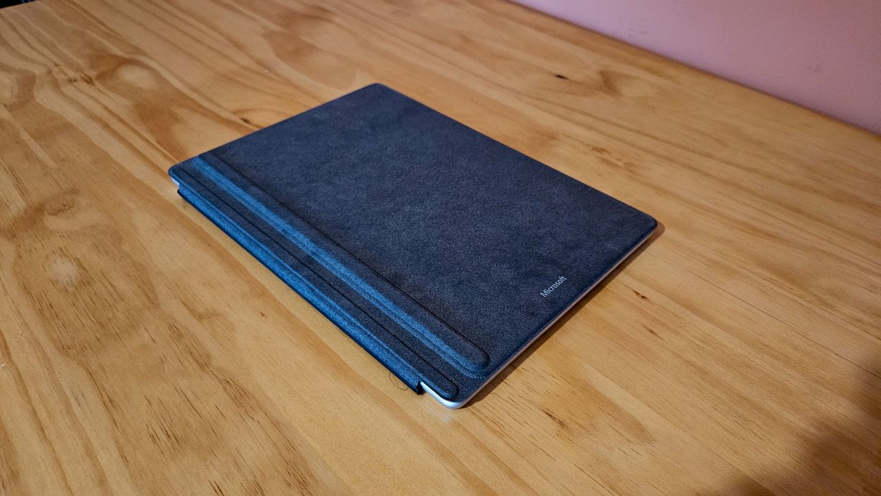 Microsoft surface pro 11 on a table (botto of laptop).
