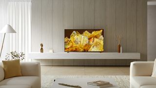 The Sony X90L in a light living room displaying a yellow pattern