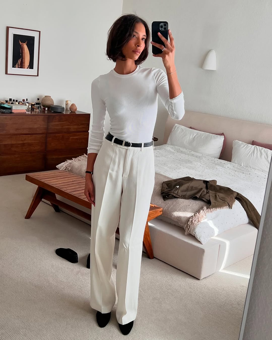 woman wearing ballet flats with white pants summer 2025
