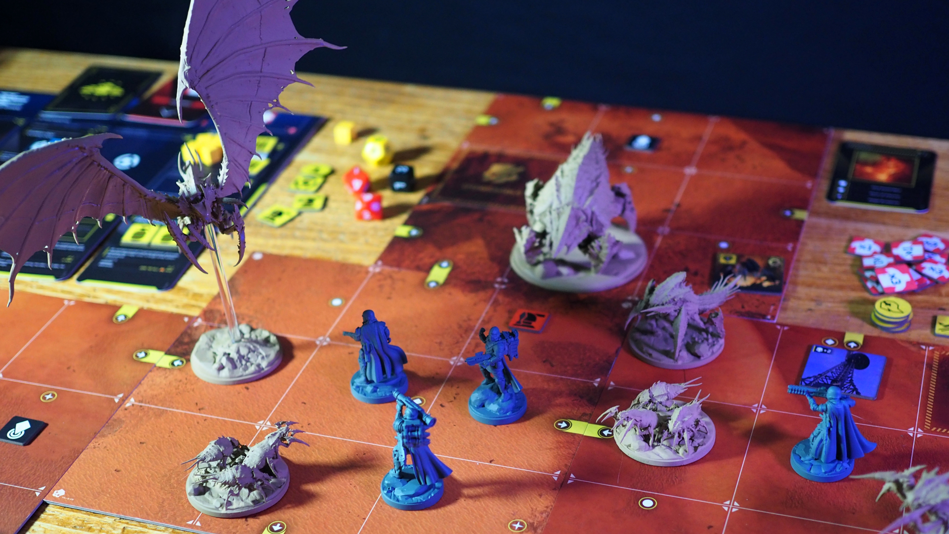 Helldivers 2 miniatures, dice, tiles, and components on a wooden table